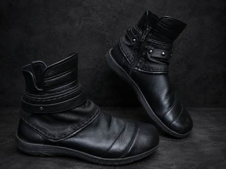 Black leather Rebel Armada ankle boots with soft ankle shape on dark studio background