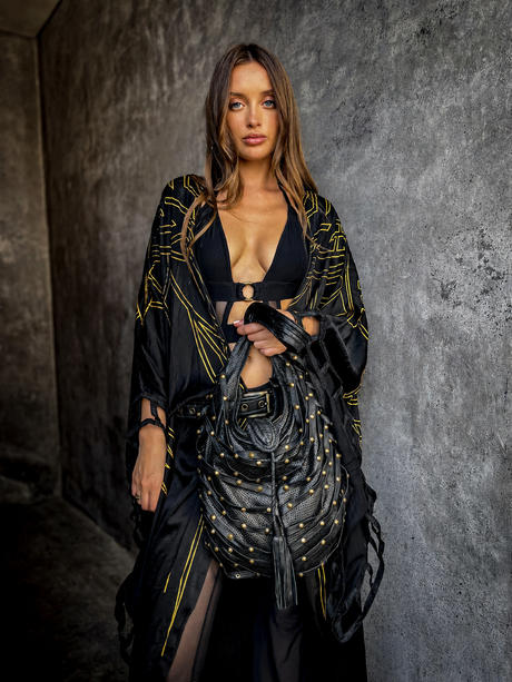 The Wing Hobo Bag black leather hobo crossbody bag handmade in Bali with brass studs and wing-style leather panels
